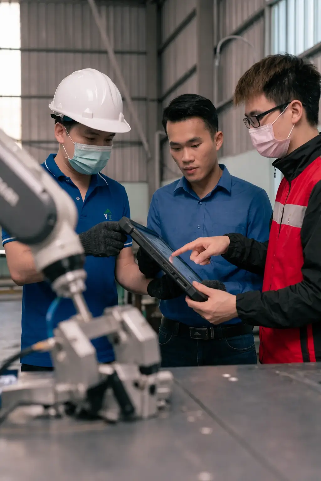 Engineers Collaborating Industrial Setting